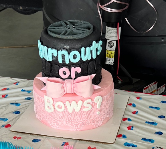 Burnouts or Bows gender reveal cake with matching cookies and table